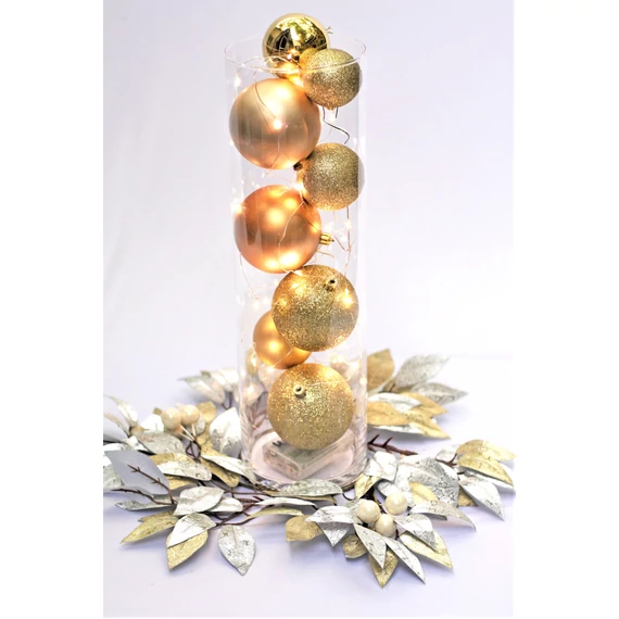 Arany karácsonyi gömbök hengervázában